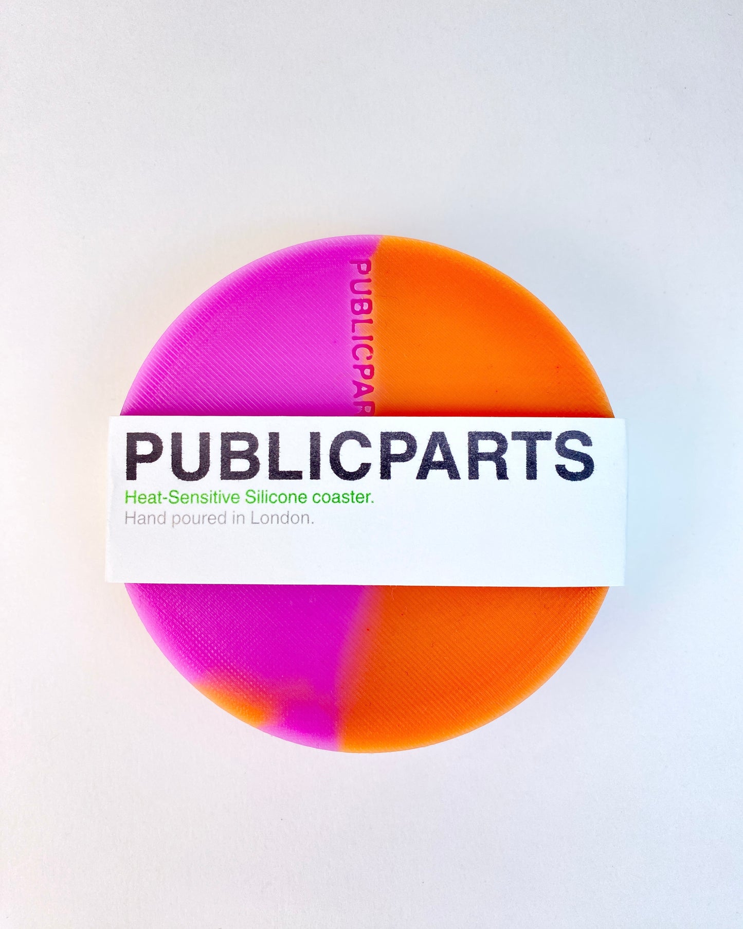 PUBLICPARTS heat-sensitive silicone coaster with branded paper sleeve packaging.