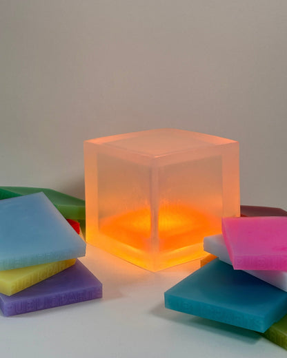 PUBLICPARTS Gel Lamp glowing with interchangeable silicone colour gels arranged around it