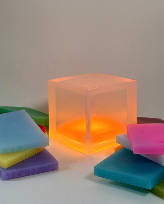 PUBLICPARTS Gel Lamp glowing with interchangeable silicone colour gels arranged around it
